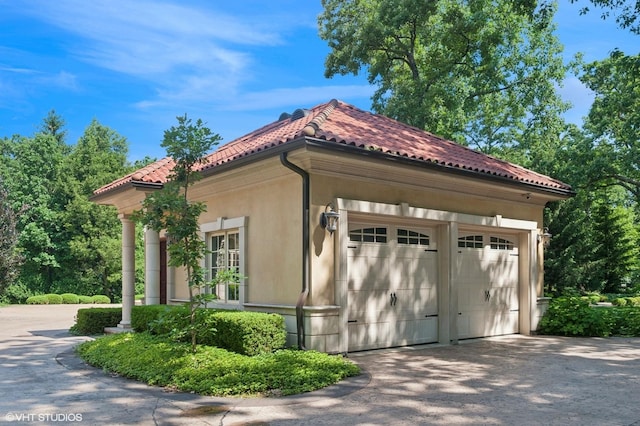 1031 Barrys Ct, Lake Forest, IL 60045 - view of home's exterior featuring a tile roof, a garage, and stucco siding