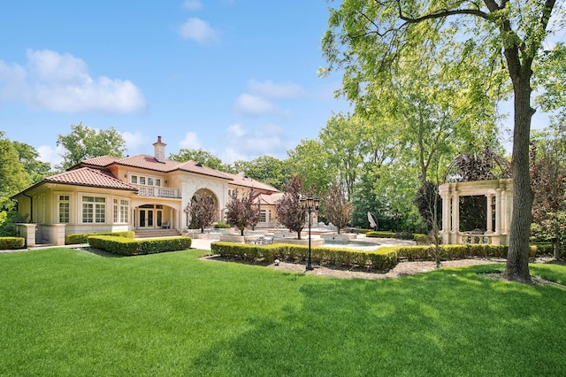 1031 Barrys Ct, Lake Forest, IL 60045 - rear view of house featuring french doors, a chimney, a yard, and a tile roof