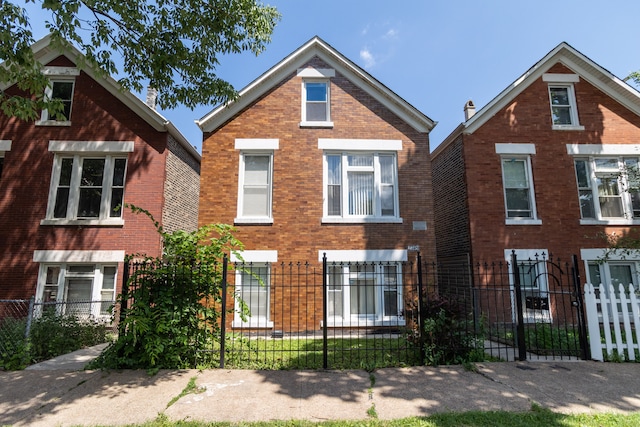 2745 S Sawyer Ave, Chicago, IL 60623 - traditional home featuring a fenced front yard and brick siding