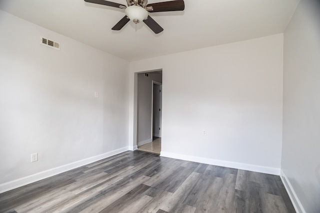 2745 S Sawyer Ave, Chicago, IL 60623 - spare room featuring ceiling fan and dark wood-style floors