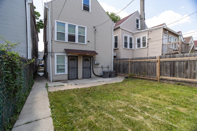 2745 S Sawyer Ave, Chicago, IL 60623 - back of property with a fenced backyard and a patio area