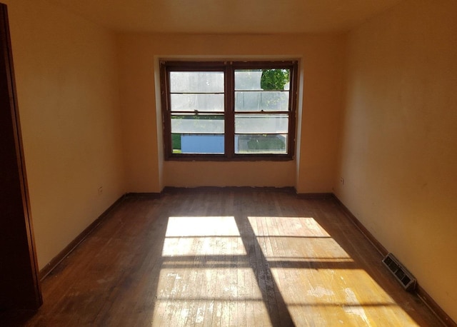 15944 Paulina St, Harvey, IL 60426 - unfurnished room featuring wood finished floors and baseboards