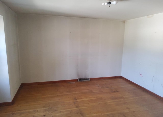 15944 Paulina St, Harvey, IL 60426 - spare room featuring wood finished floors and baseboards