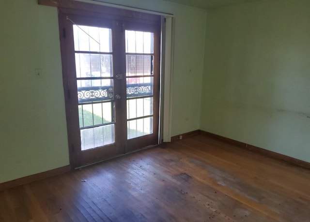 15944 Paulina St, Harvey, IL 60426 - unfurnished room featuring wood-type flooring, plenty of natural light, and french doors