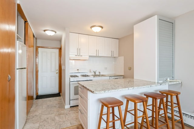 5975 N Odell Ave Unit 4F, Chicago, IL 60631 - kitchen with white appliances, under cabinet range hood, a breakfast bar, light stone countertops, and backsplash