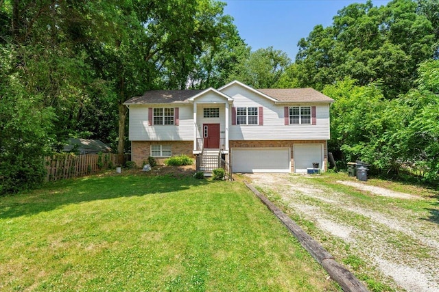 25612 W Woodlawn Ave, Antioch, IL 60002 - bi-level home with driveway, an attached garage, and brick siding