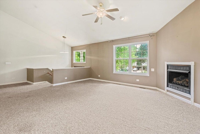 25612 W Woodlawn Ave, Antioch, IL 60002 - unfurnished living room featuring lofted ceiling, carpet flooring, a fireplace, and a ceiling fan