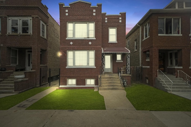 1802 S 50th Ave, Cicero, IL 60804 - view of front of house with brick siding and a yard