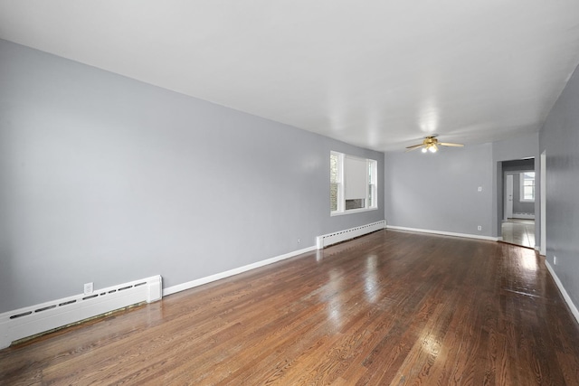 1802 S 50th Ave, Cicero, IL 60804 - spare room featuring a baseboard radiator, wood finished floors, a ceiling fan, and a baseboard heating unit
