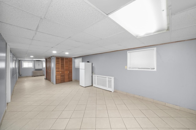 1802 S 50th Ave, Cicero, IL 60804 - below grade area with freestanding refrigerator, a paneled ceiling, recessed lighting, and radiator heating unit