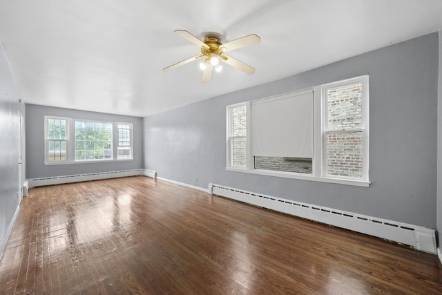 1802 S 50th Ave, Cicero, IL 60804 - spare room with a baseboard radiator, a ceiling fan, and wood finished floors