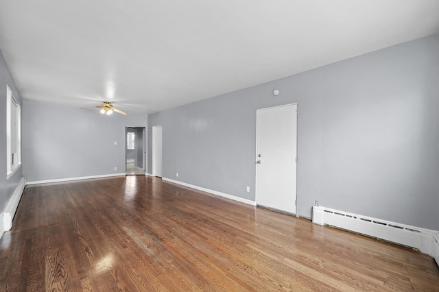 1802 S 50th Ave, Cicero, IL 60804 - unfurnished room featuring a ceiling fan, baseboard heating, and wood finished floors