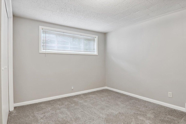 711 W Front St, Bloomington, IL 61701 - spare room with carpet floors and baseboards
