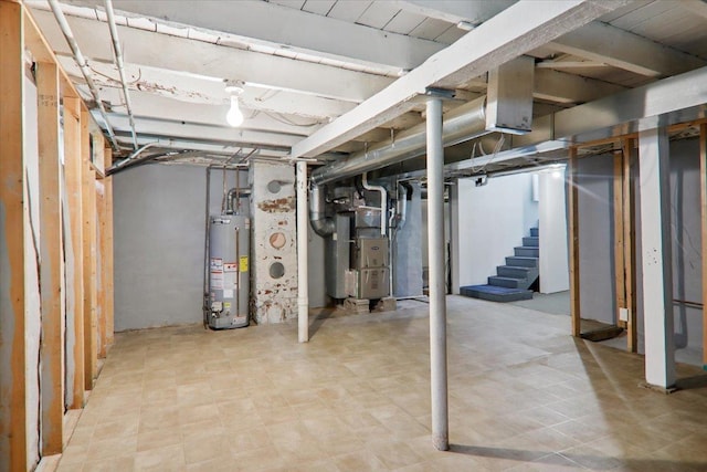 711 W Front St, Bloomington, IL 61701 - unfinished below grade area with gas water heater, heating unit, and stairs