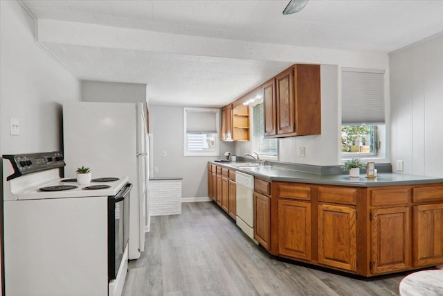 711 W Front St, Bloomington, IL 61701 - kitchen with white appliances, light wood finished floors, and plenty of natural light