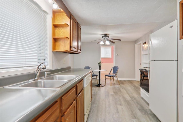 711 W Front St, Bloomington, IL 61701 - kitchen with white appliances, ceiling fan, light wood-style floors, and brown cabinetry