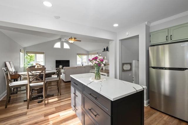 7288 174th Pl, Tinley Park, IL 60477 - kitchen featuring freestanding refrigerator, a ceiling fan, light wood finished floors, plenty of natural light, and lofted ceiling