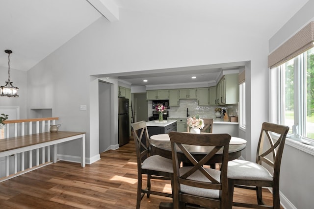 7288 174th Pl, Tinley Park, IL 60477 - dining space with dark wood-style floors, high vaulted ceiling, beamed ceiling, and a chandelier