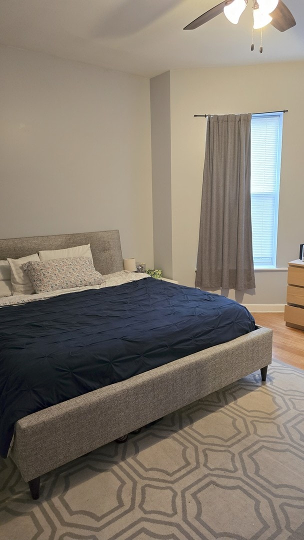 3733 S Lake Park Ave, Chicago, IL 60653 - bedroom with light wood-style floors and ceiling fan