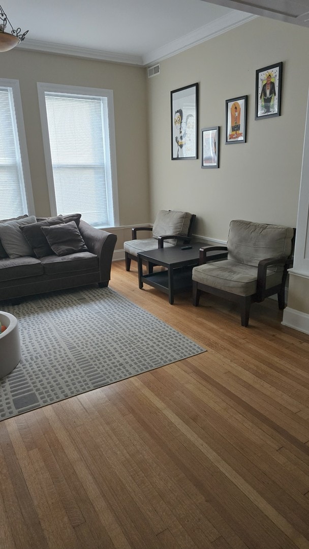 3733 S Lake Park Ave, Chicago, IL 60653 - living area featuring ornamental molding and wood finished floors