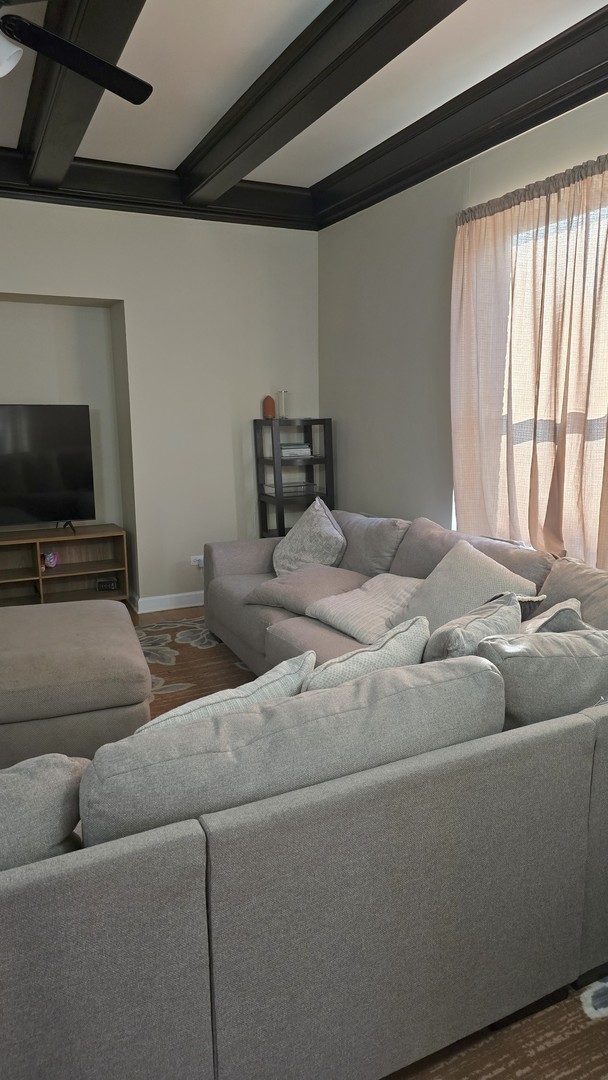 3733 S Lake Park Ave, Chicago, IL 60653 - living area featuring ceiling fan and beamed ceiling