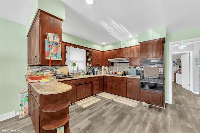 2606 Ridge Rd, Lansing, IL 60438 - kitchen with open shelves, light countertops, oven, decorative backsplash, and recessed lighting