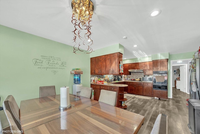 2606 Ridge Rd, Lansing, IL 60438 - dining space featuring a chandelier, recessed lighting, and wood finished floors