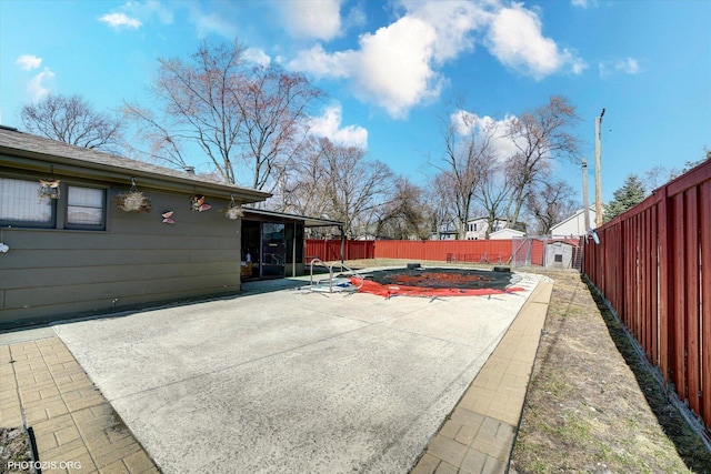 2606 Ridge Rd, Lansing, IL 60438 - fenced backyard featuring a patio and a storage unit