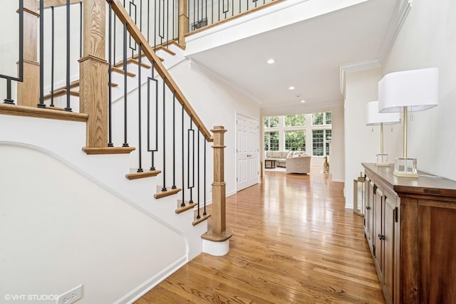 823 Balmoral Ln, Northbrook, IL 60062 - stairs with crown molding, wood finished floors, and recessed lighting