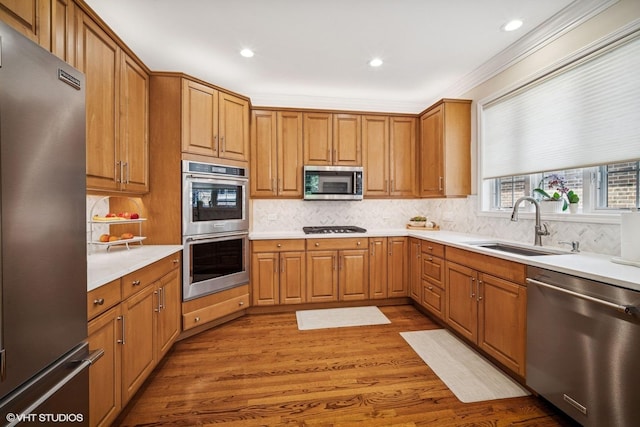 823 Balmoral Ln, Northbrook, IL 60062 - kitchen with appliances with stainless steel finishes, wood finished floors, decorative backsplash, light countertops, and recessed lighting