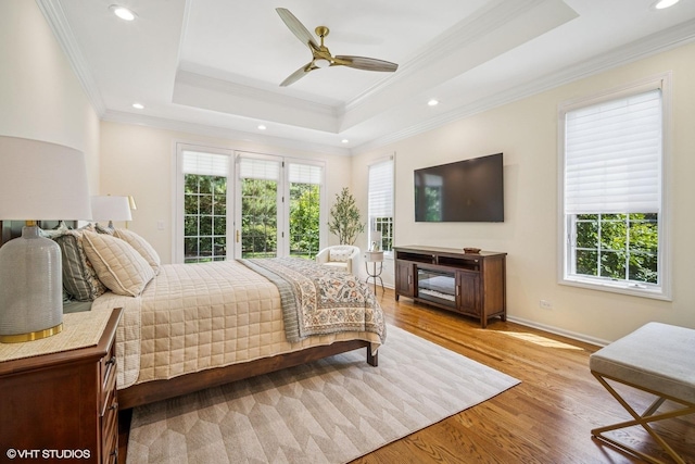 823 Balmoral Ln, Northbrook, IL 60062 - bedroom with multiple windows, recessed lighting, wood finished floors, ornamental molding, and a tray ceiling