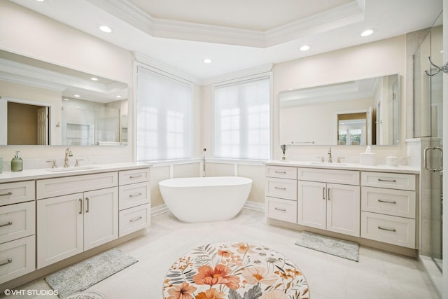 823 Balmoral Ln, Northbrook, IL 60062 - bathroom featuring ornamental molding, a stall shower, two vanities, recessed lighting, and a freestanding bath