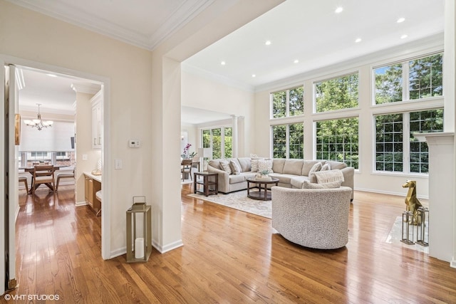 823 Balmoral Ln, Northbrook, IL 60062 - living area featuring light wood finished floors, plenty of natural light, a chandelier, crown molding, and recessed lighting