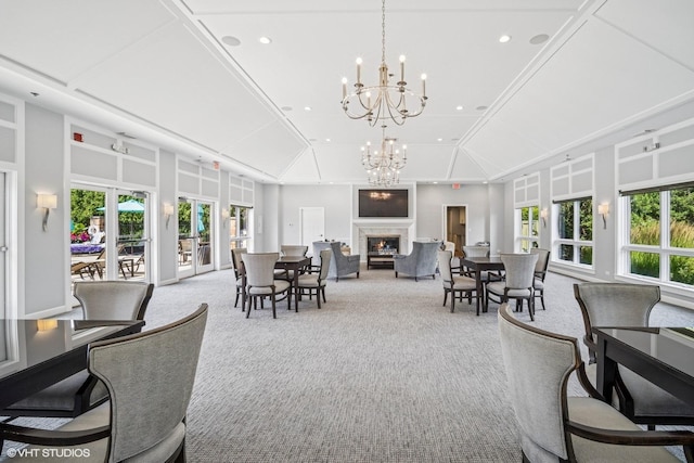 823 Balmoral Ln, Northbrook, IL 60062 - carpeted dining area featuring a lit fireplace, a chandelier, and recessed lighting