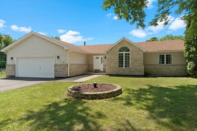 10067 W Logan Ct, Zion, IL 60099 - single story home featuring brick siding, a garage, driveway, and a front yard