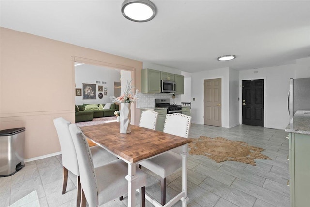 10067 W Logan Ct, Zion, IL 60099 - dining room with baseboards