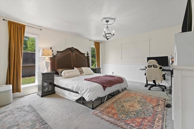 10067 W Logan Ct, Zion, IL 60099 - carpeted bedroom with a chandelier and a wainscoted wall