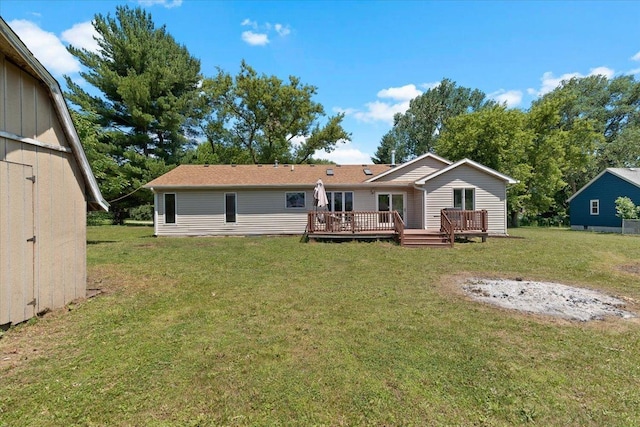 10067 W Logan Ct, Zion, IL 60099 - back of property featuring a wooden deck and a yard