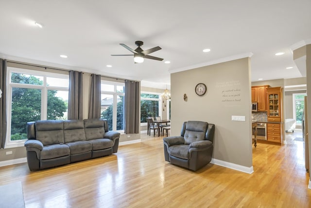 1123 Chadwick Ct, Aurora, IL 60502 - living area with ceiling fan, light wood finished floors, recessed lighting, a chandelier, and ornamental molding
