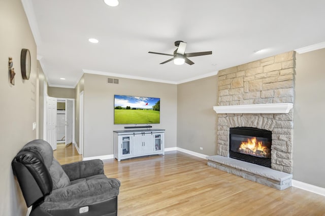 1123 Chadwick Ct, Aurora, IL 60502 - living area with ceiling fan, a fireplace, crown molding, wood finished floors, and recessed lighting