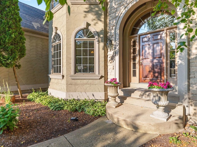 1123 Chadwick Ct, Aurora, IL 60502 - view of exterior entry with roof with shingles and stone siding