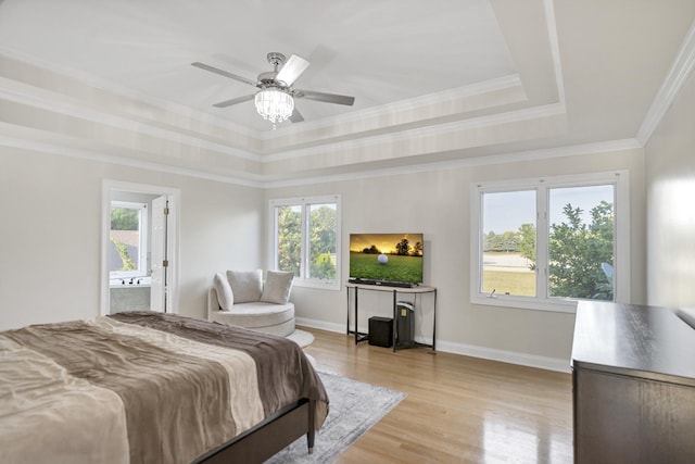 1123 Chadwick Ct, Aurora, IL 60502 - bedroom with a tray ceiling, light wood-type flooring, crown molding, ensuite bathroom, and a ceiling fan