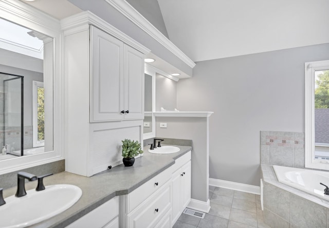 1123 Chadwick Ct, Aurora, IL 60502 - bathroom with a garden tub, double vanity, tile patterned floors, and a shower with shower door