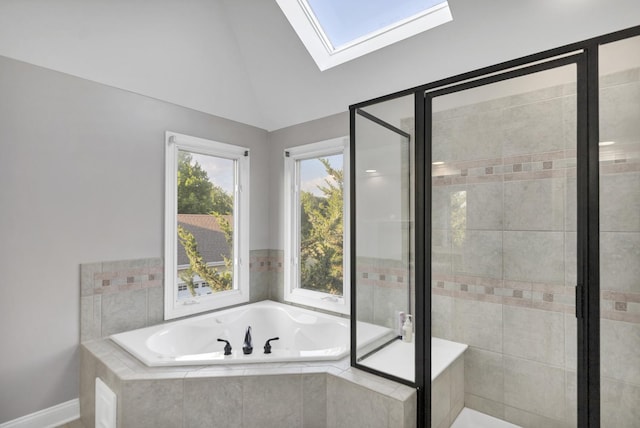 1123 Chadwick Ct, Aurora, IL 60502 - full bathroom featuring a skylight, a garden tub, a stall shower, and lofted ceiling