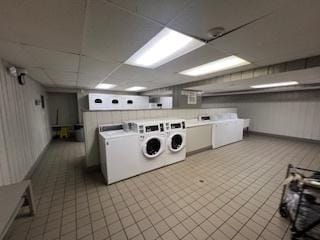 18 E Old Willow Rd Unit 106N, Prospect Heights, IL 60070 - community laundry with washing machine and clothes dryer and tile patterned flooring