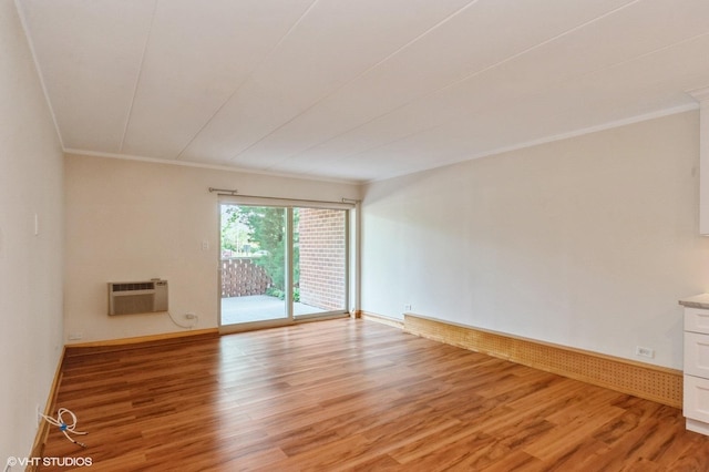 18 E Old Willow Rd Unit 106N, Prospect Heights, IL 60070 - unfurnished room with light wood-type flooring, ornamental molding, and a wall mounted AC