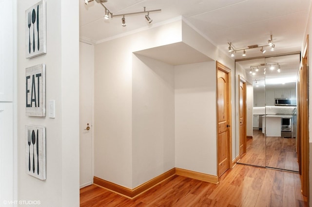18 E Old Willow Rd Unit 106N, Prospect Heights, IL 60070 - corridor featuring track lighting, wood finished floors, and ornamental molding