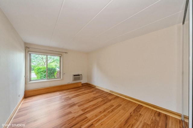 18 E Old Willow Rd Unit 106N, Prospect Heights, IL 60070 - empty room with light wood-type flooring and a wall unit AC