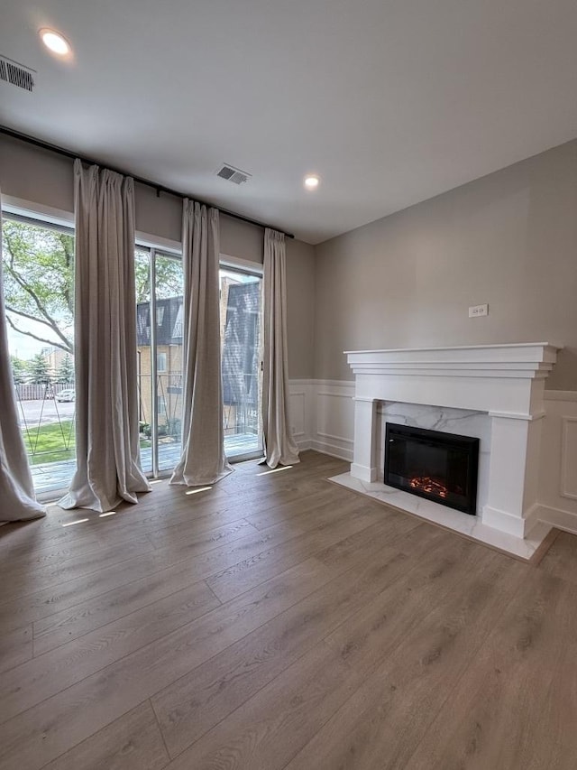 4819 W 109th St Unit 204, Oak Lawn, IL 60453 - unfurnished living room with a fireplace, wood finished floors, a decorative wall, wainscoting, and recessed lighting