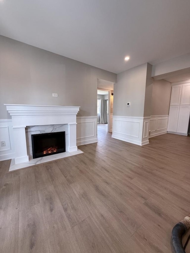 4819 W 109th St Unit 204, Oak Lawn, IL 60453 - unfurnished living room with a premium fireplace, wood finished floors, a wainscoted wall, a decorative wall, and recessed lighting